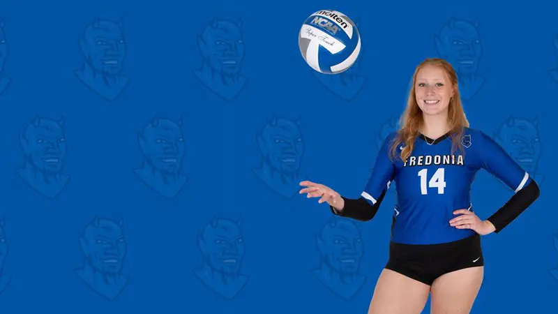 Christie Ackendorf throwing volleyball