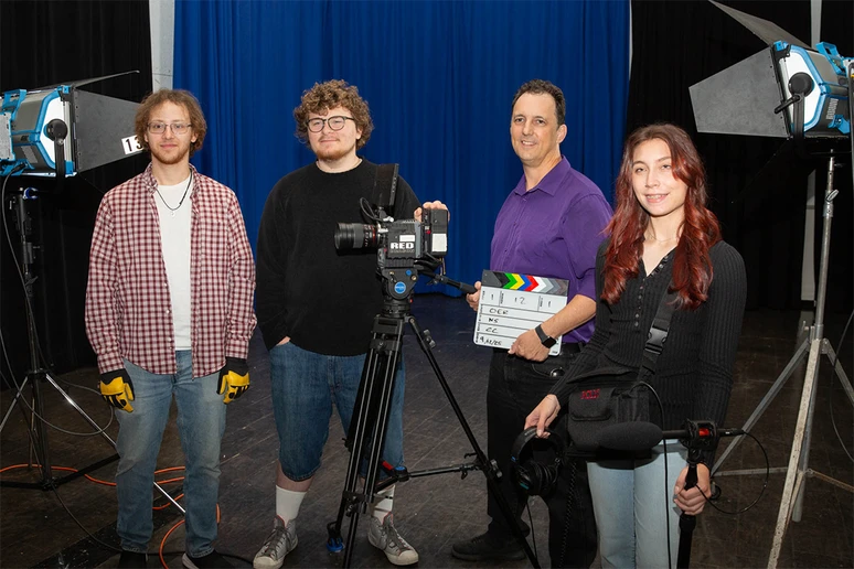 Nicholas Smith (second from right), with his student crew (from left) Anthony Derby, Conor Clary and Samantha Zotara in the McEwen Hall film studio.