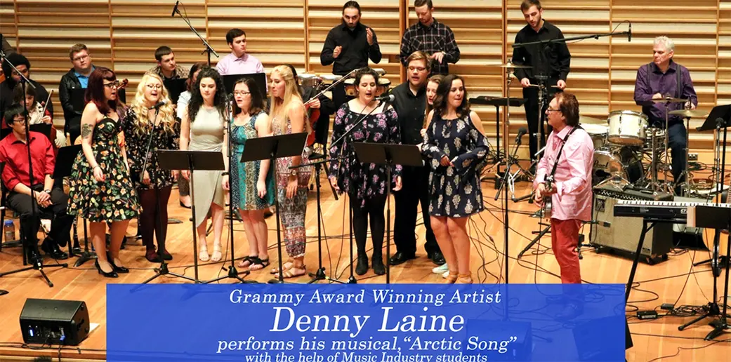 Denny Laine, playing guitar on the right, performs his musical, “Arctic Song,” in Rosch Recital Hall.