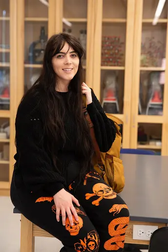 Rachel Echevarria, who has majors in Environmental Sciences and Geology, in the Gilman Minerology and Petrology Lab in Houghton Hall Room 132.