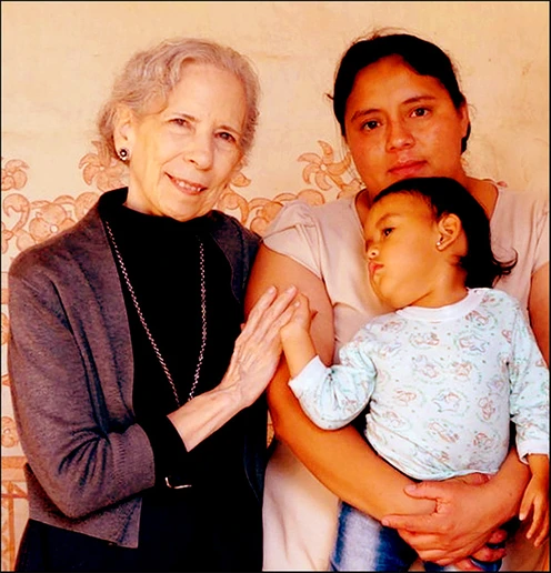 Ellen Camus, with members of a migrant family (photo courtesy of the Corner Institute).