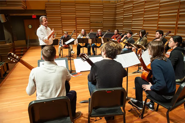members of the guitar ensemble rehearsing