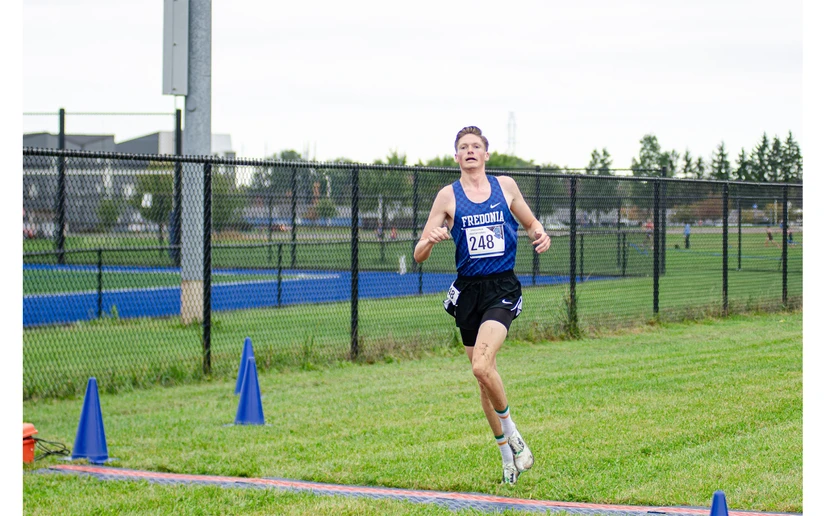 cross country runner in action by Riley Olson