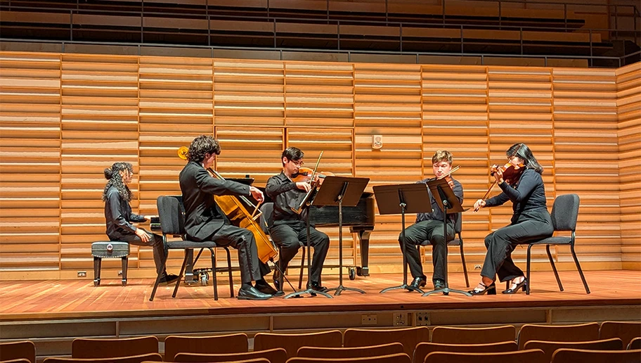 A quintet comprised of (from left): Nakai Weeks (piano), Cooper Corcoran (cello), Matthew Kenyon (viola), Noah Grossbard (violin) and Emily Flores (violin), performs at the first Student Composer Concert of the 2024-2025 school year.