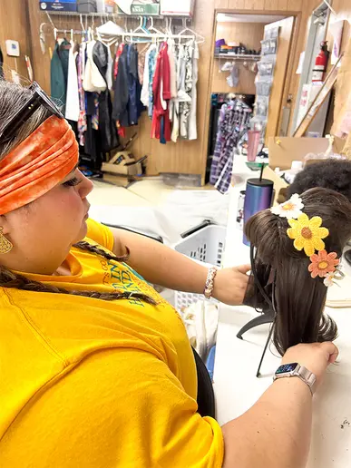 Haylee Morris preps Sandra Roberts' (Adriana) wig before the cast arrives.