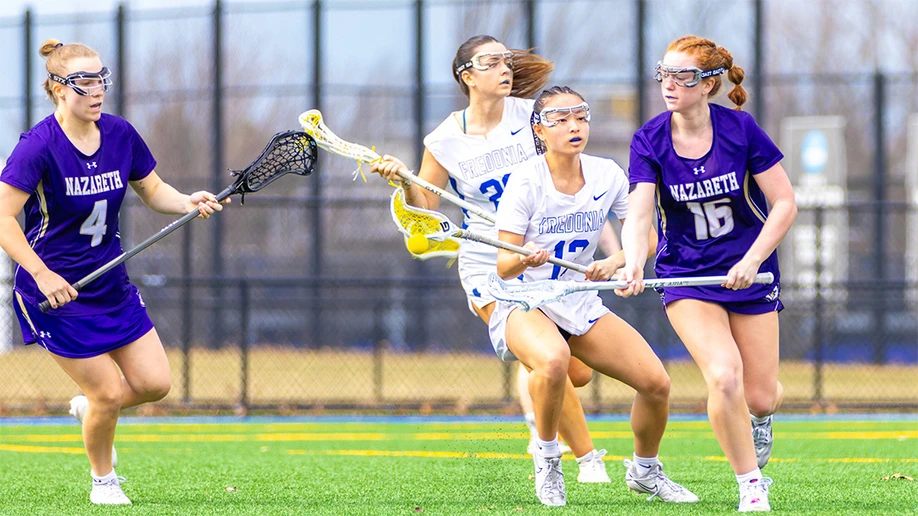 lacrosse players in action at University Stadium