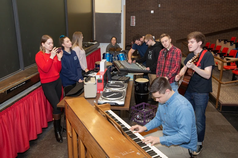 Students engaged with an activity in a music industry project