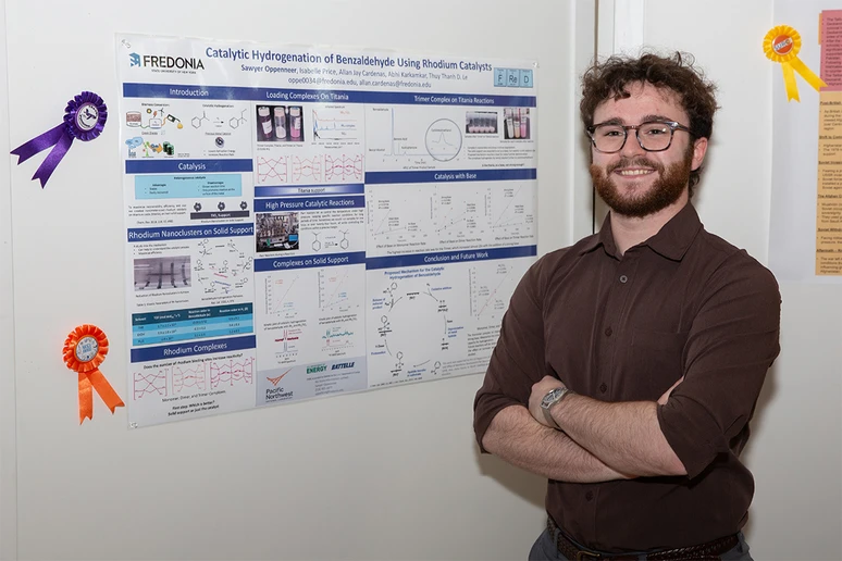 Sawyer Oppenneer, with his award-winning research poster.