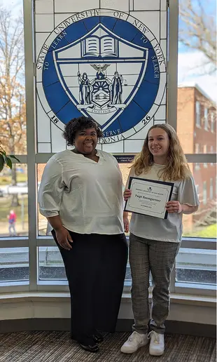 Paige Baumgartner and Nixon Hall Residence Director Heather Williams.