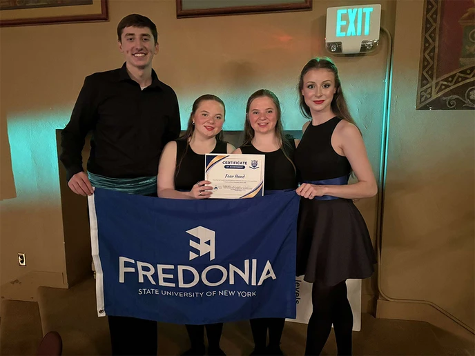Members of the 4-hand team are (from left): Jackson Kelly, junior; Makayla Mohrman, junior; Ally Mohrman, junior; and Holly Adamski, first-year.