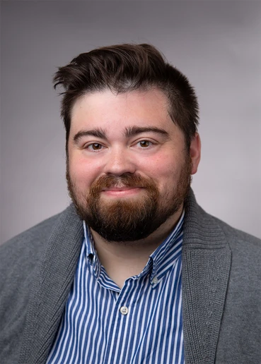 head shot of Dr. Travis Gratteau-Zinnel 