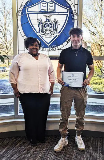 Angelo Walker, with Nixon Hall Residence Director Heather Williams.