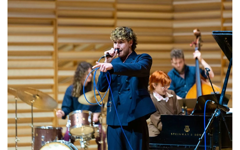 Lucas West singing on Rosch Recital Hall stage