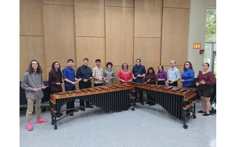students standing in front of xylophones