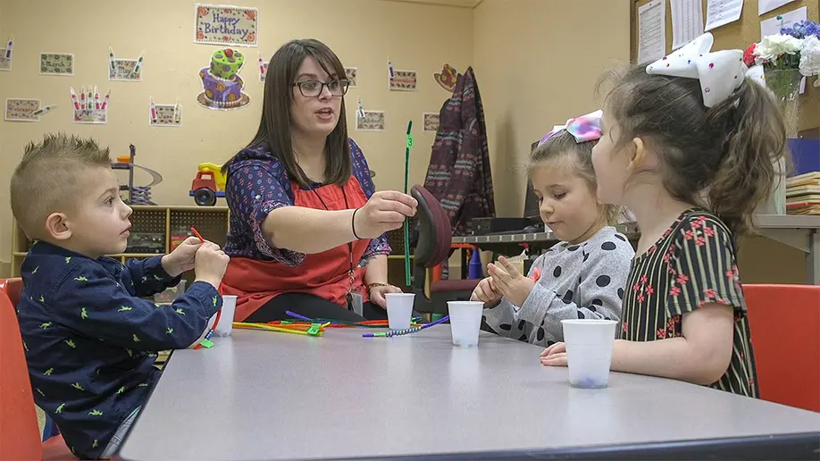 Children engaging in a learning activity at the preschool held at the Henry C. Youngerman Center for Communication Disorders at SUNY Fredonia.