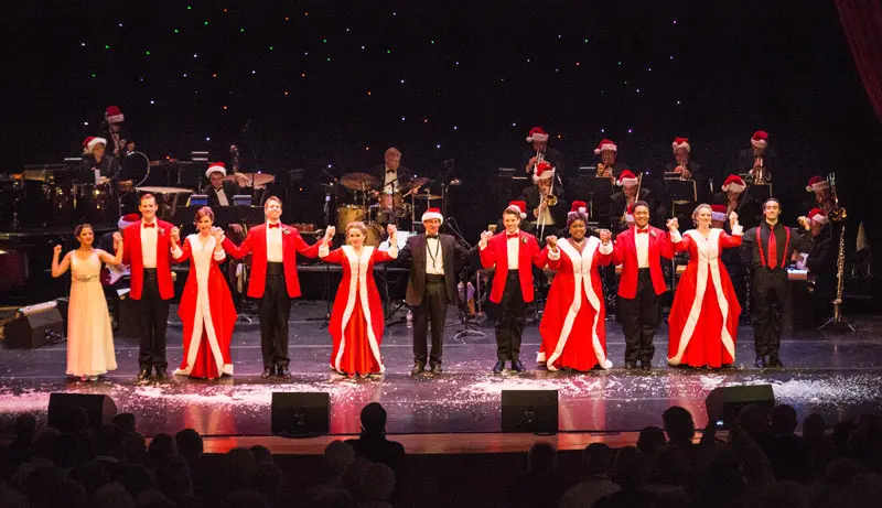 singers in Christmas costumes