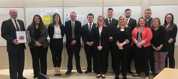 business students with consultant
