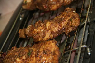 photo of chicken on the grill