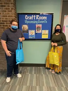 students delivering craft supplies