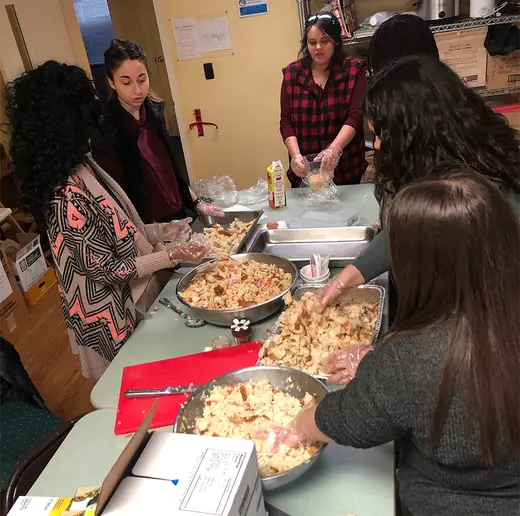 Members of the Fredonia Democracy Initiative prepare food at Chautauqua Rural Ministry in Dunkirk