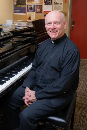 Fr. Sean Duggan at piano