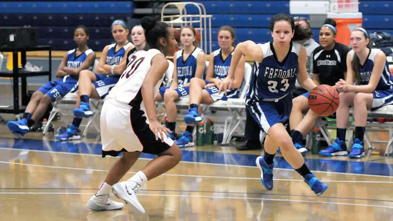 Becky Hebert (23) dribbles around a defender in a game at Steele Hall.