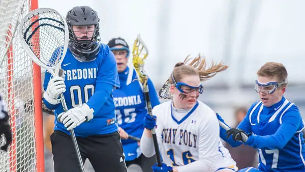 Bridget Carey (left) keeps an eye on SUNY Poly's Kayla Prosinski, who's guarded by Casie White.