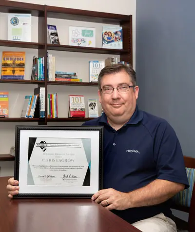 Christoper LaGrow with award