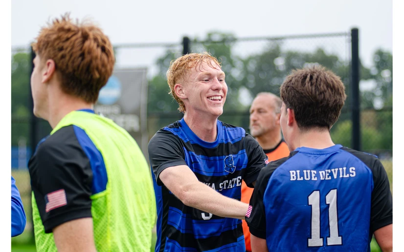 soccer players celebrating by Riley Olson