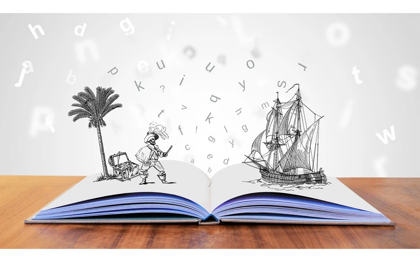illustration of open book with characters and letters by tumisu
