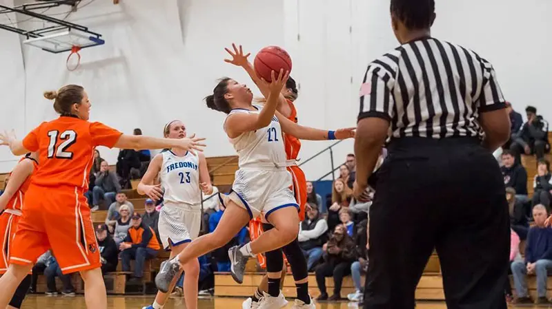 Rae White (22) goes for two points