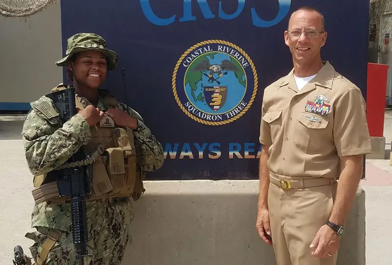 Petty Officer Electronics Technician 2nd Class Heaven Rollek with U.S. Navy Reserves Senior Chief Jeff Walter.
