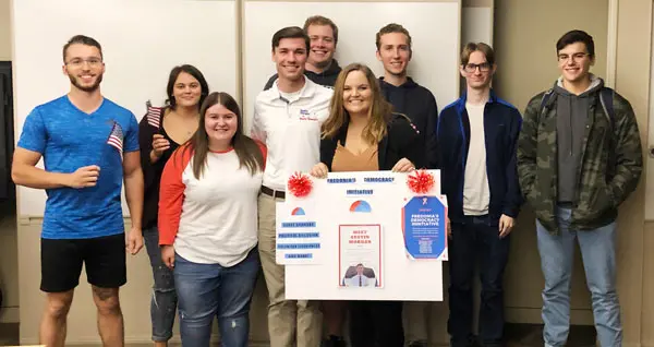 Austin Morgan with students