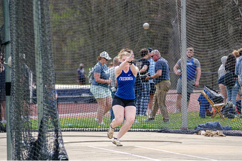 athlete throwing in competition