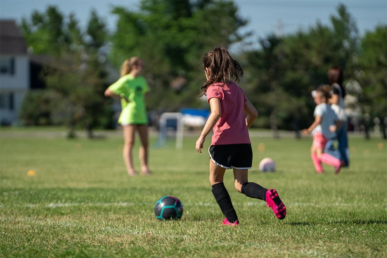 girls on a soccer field