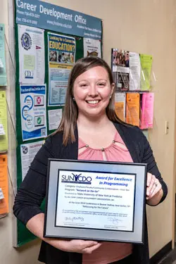 photo of Jennifer Wilkins holding award