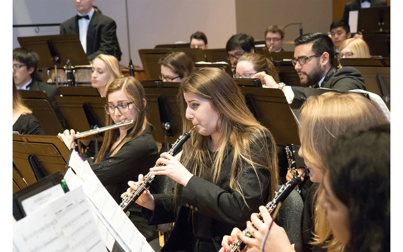 students performing on stage