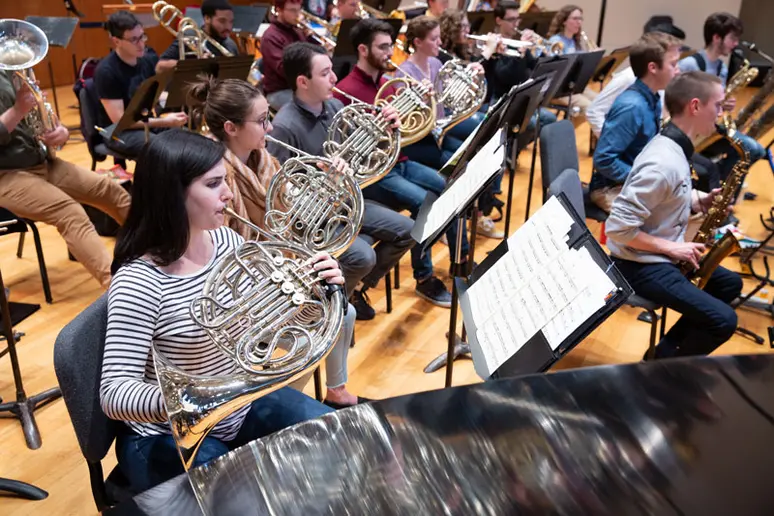 members of the wind ensemble performing