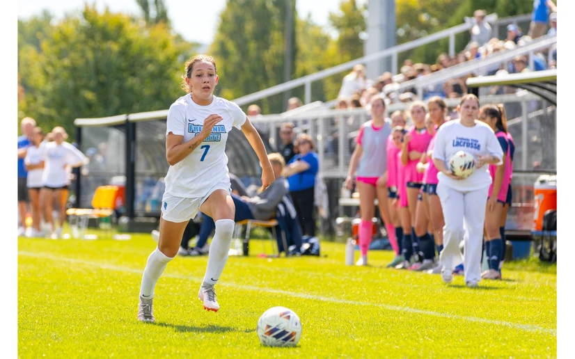 soccer player in action by Travis Bernhard