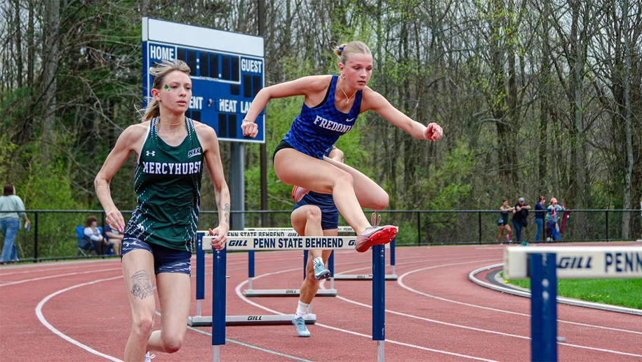 women running hurdles