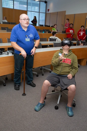 Christopher Taverns guides a student in a virtual reality lesson. 