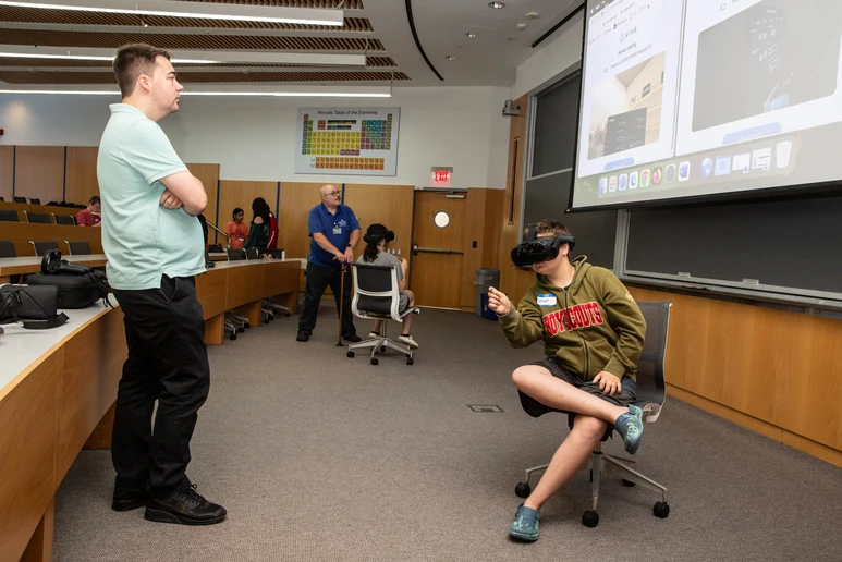 Daniel LaGrow interacts with a student in a virtual reality experience. 
