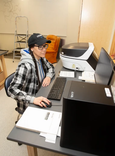 Cece Young, senior majoring in Geology, in the Physics Research Laboratory in Houghton Hall.
