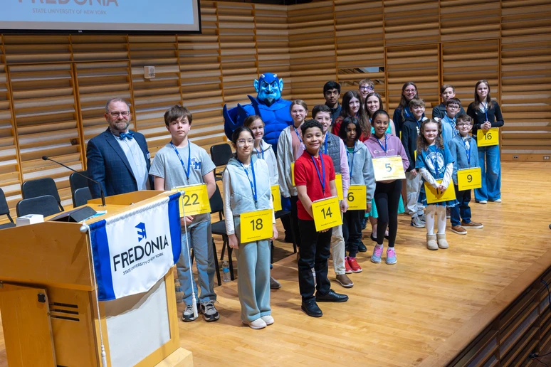 Spellers from western New York on the Juliet J. Rosch Recital Hall stage at SUNY Fredonia.