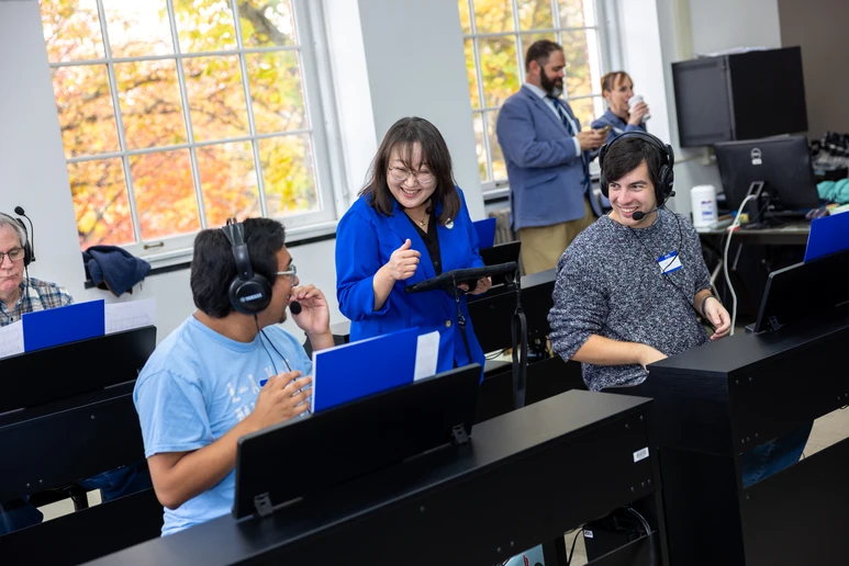Assistant Professor Jiyong Kim Mai with two students at the ribbon-cutting ceremony for the renovated piano lab.