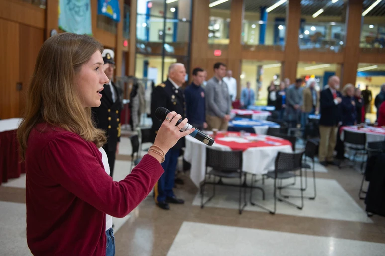Ava Hartung, a Music Education major, sings the “Star Spangled Banner” at the opening of the Veterans Remembrance Ceremony.