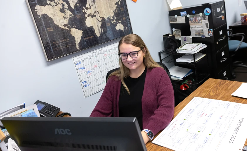 Alexis Tofil working at her desk 