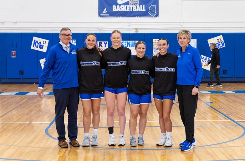senior basketball players with coaches