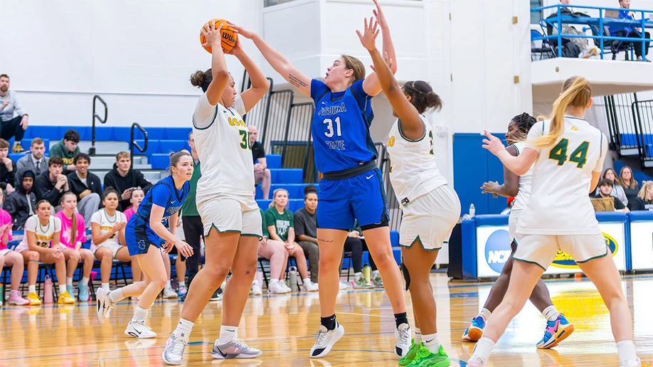 women basketball players in action on the court