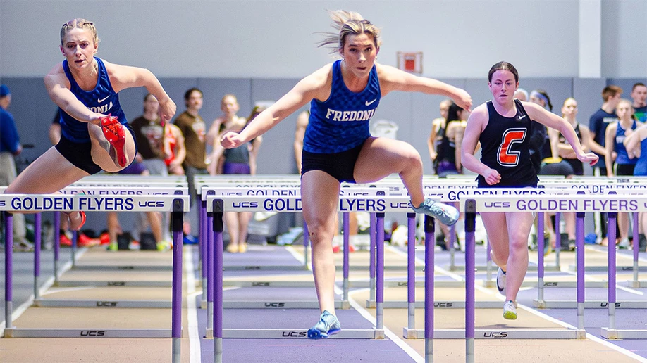 women running hurdles